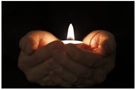 Healthy grieving dark room candle hands